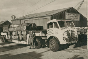 Eric Whatton alongside truck at sawmill